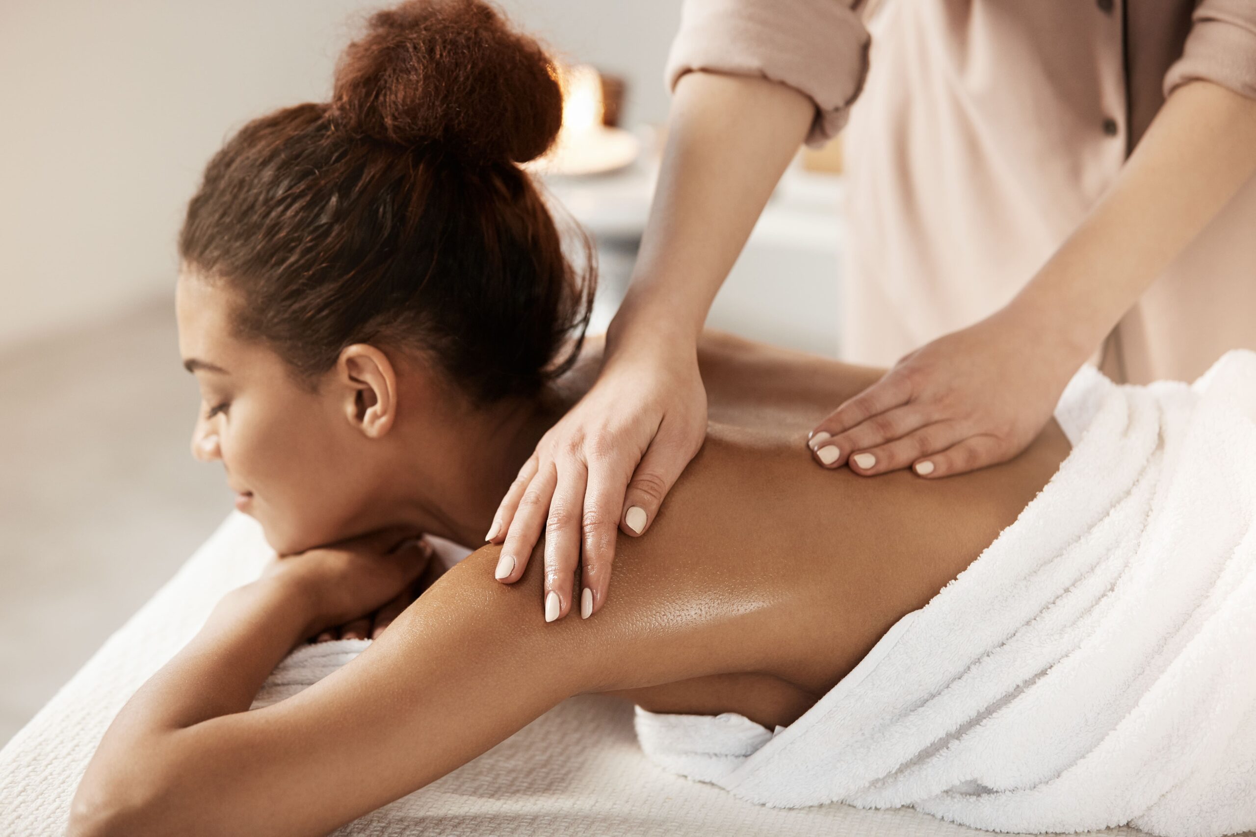 attractive-african-woman-having-massage-relaxing-spa-salon-closed-eyes (1) Massage Theraphy