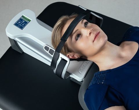 modpod-womanstrappedin_1_orig Spinal Decompression Image